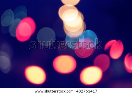 Night city street lights bokeh blur background. Defocused urban abstract texture bokeh city lights on the background with blurred colorful lights.