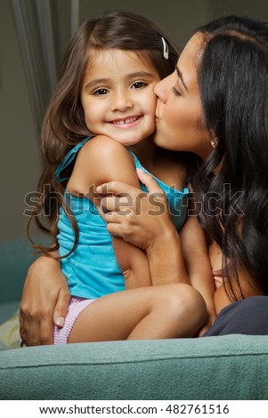 Hispanic mother and daughter.