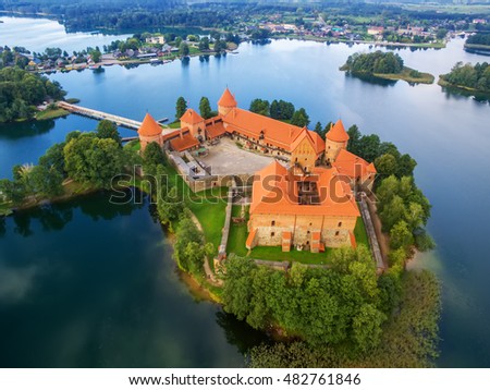 Trakai, Lithuania: medieval gothic Island castle, located in Galve lake and town in the background. Aerial above summer UAV top view, flat lay of the most beautiful Lithuanian landmark.