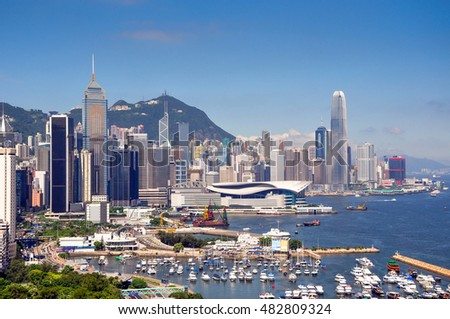 Aerial view to Hong Kong skyline, skyscrapers and harbor 