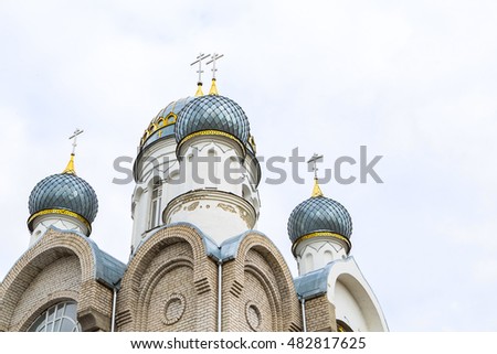 The construction of the new Church. Belorussian Church building. Silver and golden dome and cross