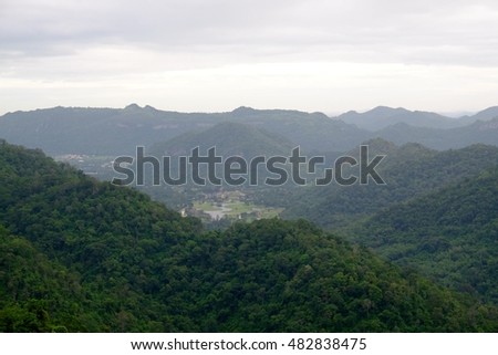 Foggy mountain landscape and cloudy sky