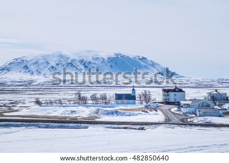 Small Building with snow mountain in the background, Iceland