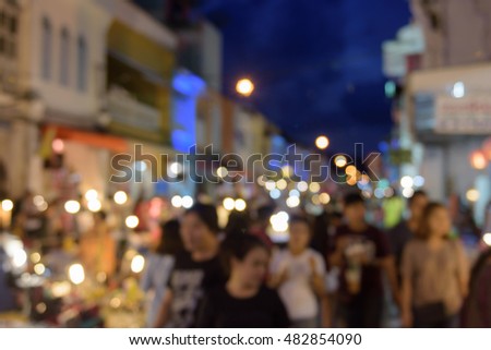 Bokeh, lens blur light on night, working street in Phuket old town only Sunday.