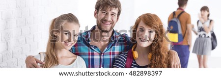 Shot of a group of happy friends smiling at the camera