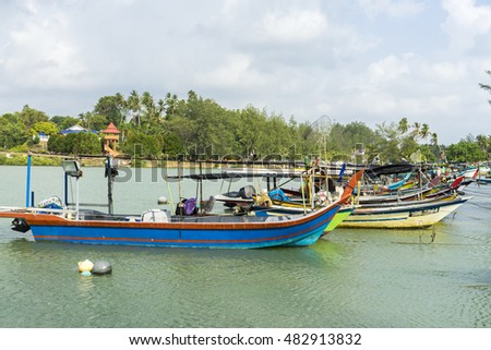 fisherman boat dock in the shallow water
