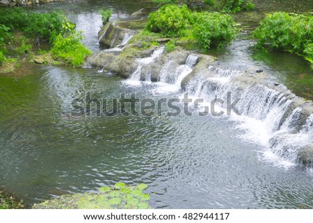 Mini waterfall in the city park or garden in 
restaurant. Natural scene. Beauty in nature