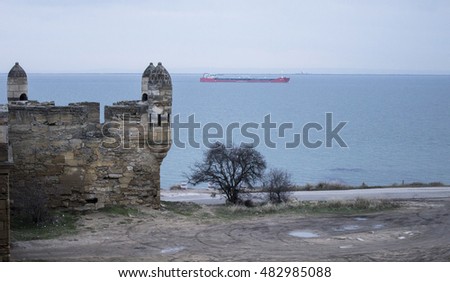 Ship in the Black Sea. Ancient fortress Ene-Kale in Kerch