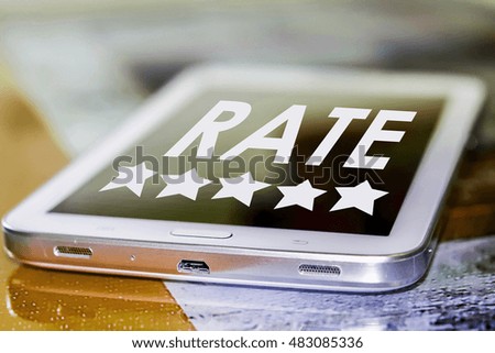 Smartphone with 5 stars and rate button on phone screen.