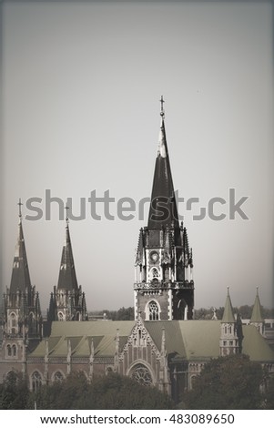 Church of Sts. Olha and Elizabeth with observation deck under the blue sky in Lviv, Ukraine. Gothic style building. Photo with space for text. Picture in vintage tone