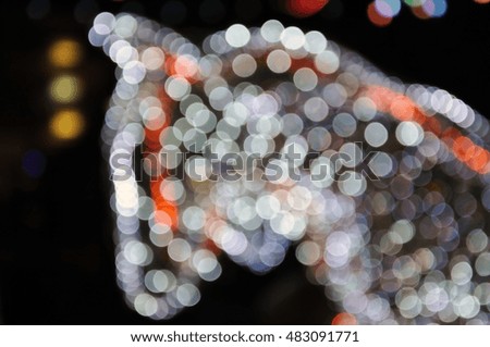 Christmas background. Horse's head in the New Year electric lights in the dark. Blur, bokeh.