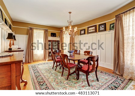 Traditional dining room interior with antique furniture and rug. Northwest, USA