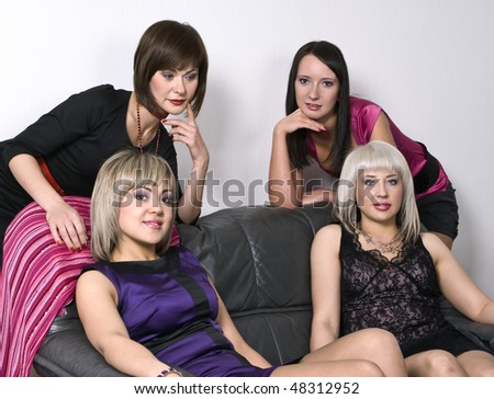 Picture of four attractive joyful girls on a party
