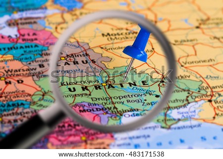 Magnifying glass with the Map of Ukraine with a blue pushpin stuckMap of Ukraine with a blue pushpin stuck Royalty-Free Stock Photo #483171538