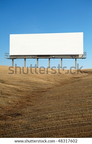 Blank commercial billboard outdoor on top of hill blue sky on background