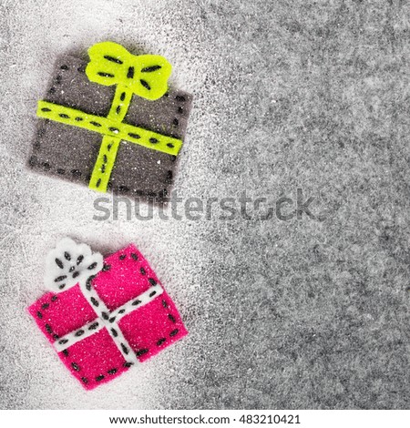 Christmas background with felt decoration: colorful gifts