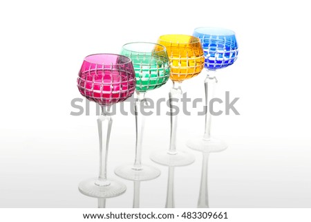 four elegant color glasses with champagne on a bar counter