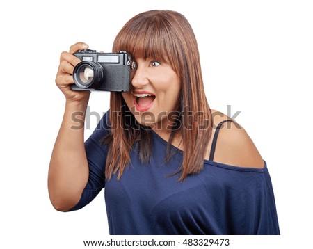 Beautiful brunette woman taking photo with vintage reflex isolated on white