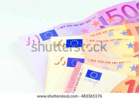 european money in coins and notes closeup on a white background