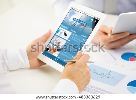 business, people, technology, internet and media concept - close up of businessman hands with news web page on tablet pc computer screen at office