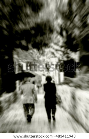 blur abstract of a lover couple  walking in the garden