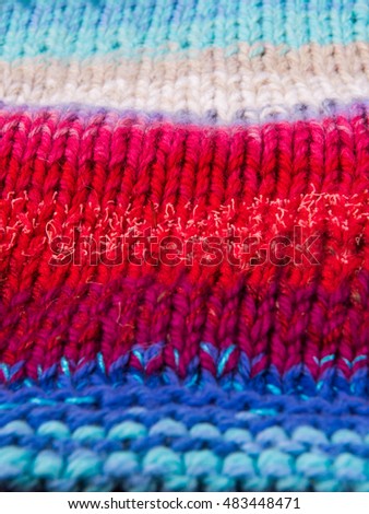 striped colorful wool texture handmade patten closeup macro blue red white biege