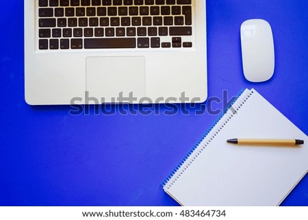 
laptop notebook mouse over color background