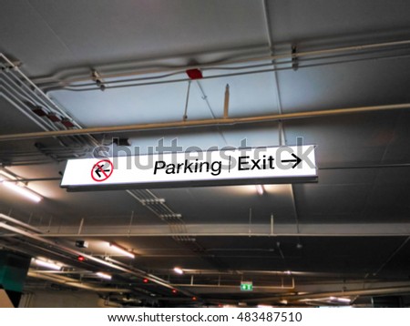 Parking and exit sign in car park
