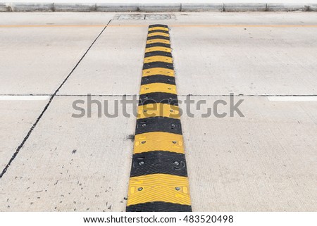Black and yellow hazard protection on the road
