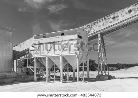industrial container at the plant for the production of building mixtures  . Black and white photography.