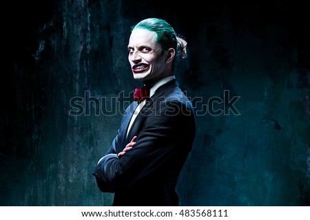 Bloody Halloween theme: The crazy joker face on black background