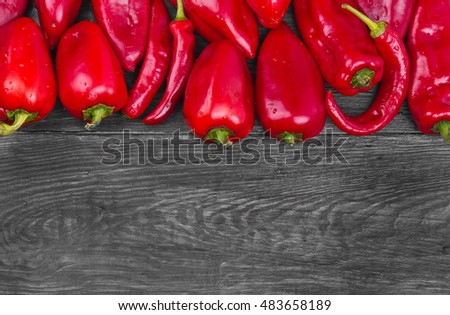 red pepper on a black wooden background
