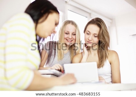 Teenage girls studying together