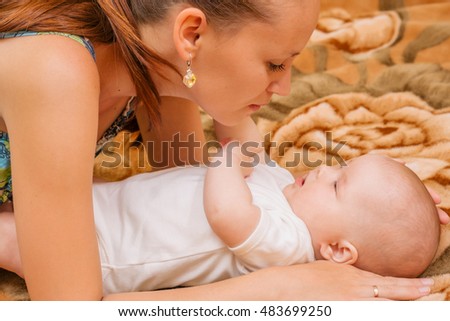 mother playing with her child.girl