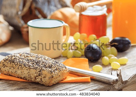 Fresh fruits and honey on a table