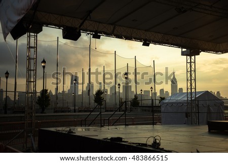 A stage with New York City in the background