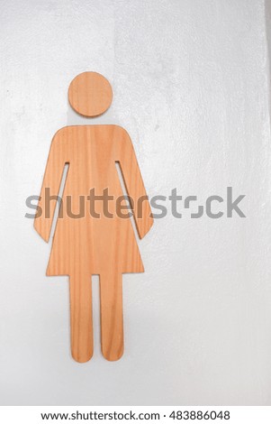 women wood toilet sign