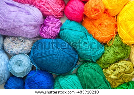 Colored balls of yarn. View from above. Rainbow colors. All colors. Yarn for knitting. Skeins of yarn. Royalty-Free Stock Photo #483910210