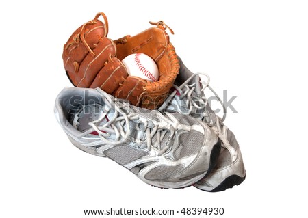 Old shoes with baseball in glove isolated on white background with clipping path.