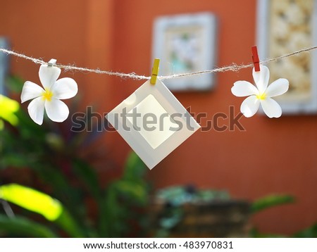 Photo Frames on Rope with flower. background the nature, soft focus