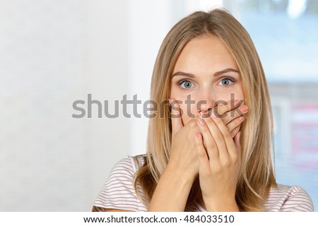 picture of teenage girl with finger on lips
