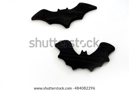 Black wooden toys shaped as bat for Halloween party