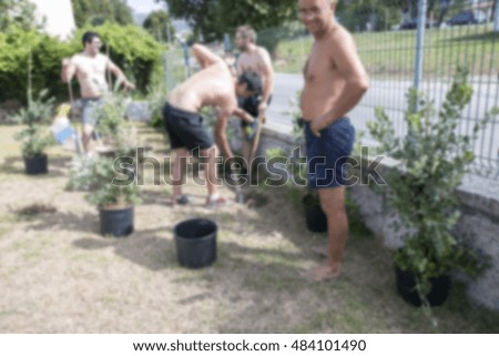 Blurry image of work in the garden without security.