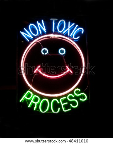 neon sign on window of dry cleaner