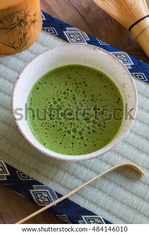 Japanese Matcha green tea in a chawan or traditional ceramic bowl with a tatami mat background Royalty-Free Stock Photo #484146010