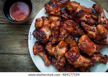 chicken wings with smoked bbq sauce for dip Royalty-Free Stock Photo #484177594