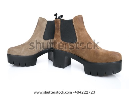 Female brown leather boot on white background, isolated product.