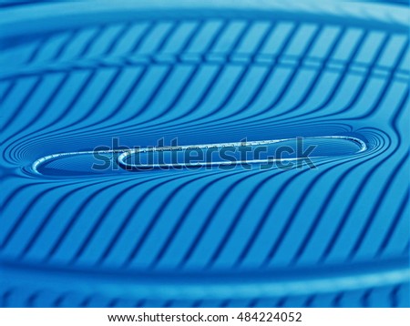 Surface tension - paperclip on water surface macro, in striped lighting, not photoshopped, simple physics