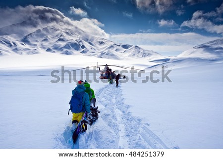 Heli  freeride snowboarding from the top of volcano Royalty-Free Stock Photo #484251379