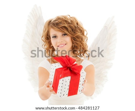 people, holidays, christmas, birthday and religious concept - happy young woman with angel wings holding gift box over white background